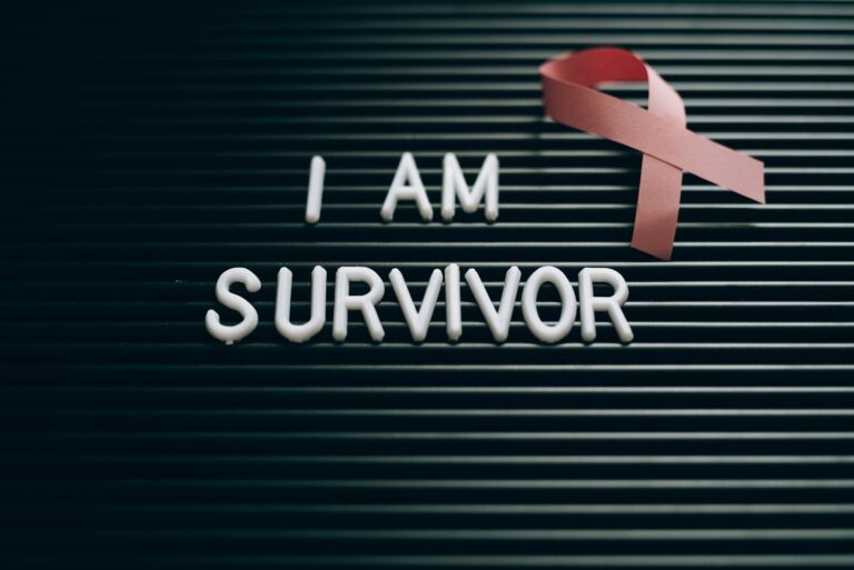 Inspiring message with a pink ribbon symbolizing breast cancer survival and awareness.